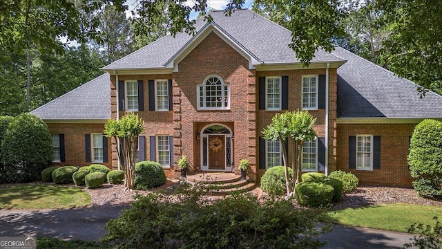 1681 Wild Azalea Ln, Athens, GA 30606 - colonial house with brick siding and a shingled roof