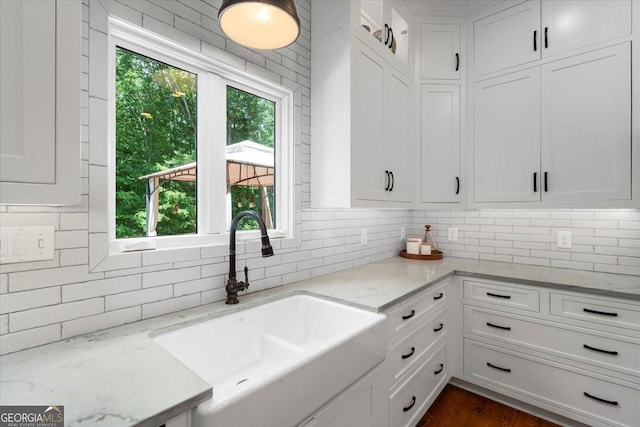 1681 Wild Azalea Ln, Athens, GA 30606 - kitchen with a sink, tasteful backsplash, white cabinetry, and light stone countertops