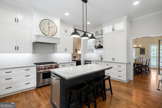 1681 Wild Azalea Ln, Athens, GA 30606 - kitchen with designer range, a sink, white cabinetry, a kitchen breakfast bar, and ornamental molding