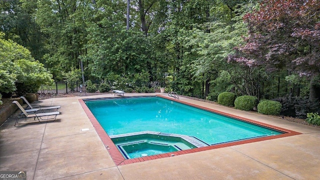 1681 Wild Azalea Ln, Athens, GA 30606 - view of pool featuring a patio area, fence, and a pool with connected hot tub