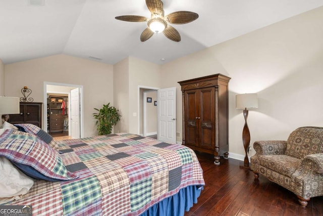 bedroom featuring wood-type flooring, lofted ceiling, baseboards, and a ceiling fan