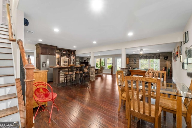 dining area with bar, stairs, dark wood-type flooring, ceiling fan, and recessed lighting
