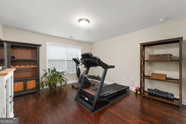 workout area with hardwood / wood-style floors and baseboards
