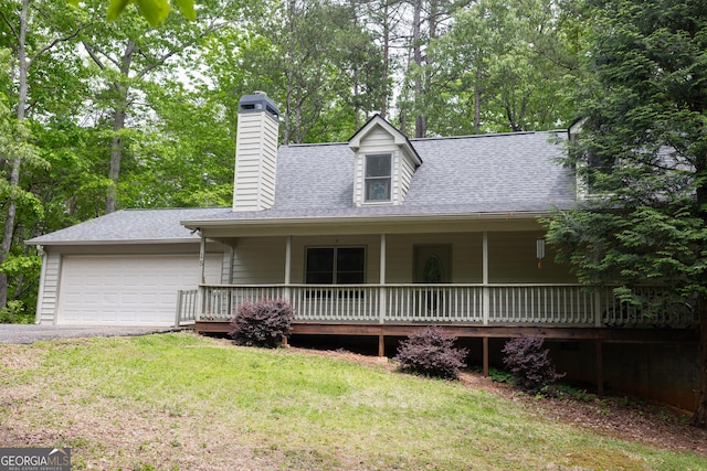 view of front facade featuring a garage, a chimney, a front lawn, a shingled roof, and asphalt driveway