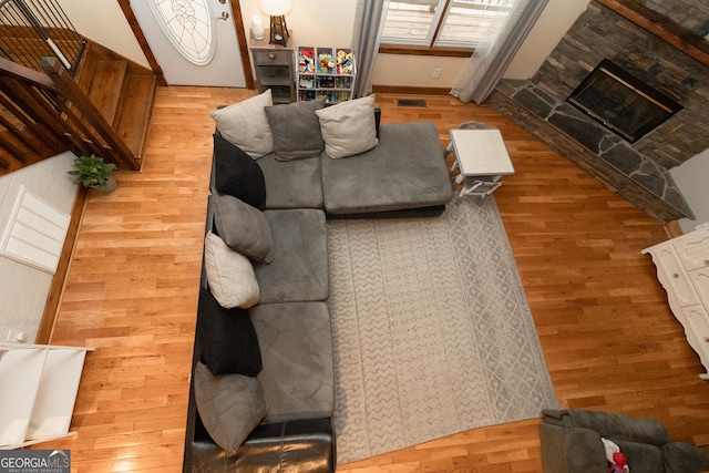 living area featuring wood finished floors and wood walls