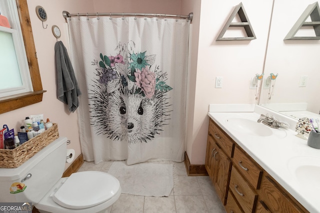 full bath with toilet, double vanity, tile patterned floors, and curtained shower