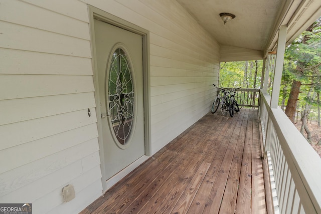 wooden terrace with a porch