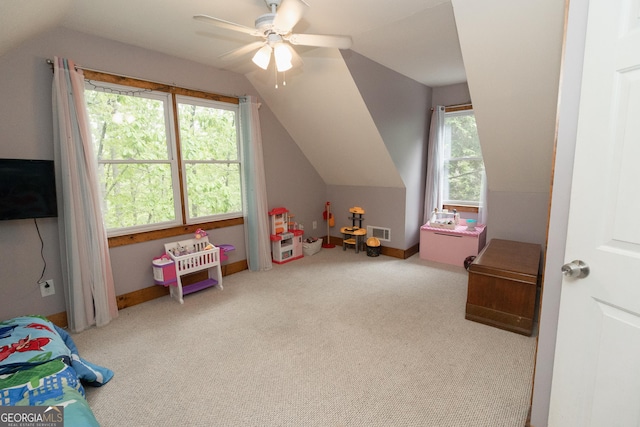 recreation room featuring vaulted ceiling, carpet flooring, and ceiling fan