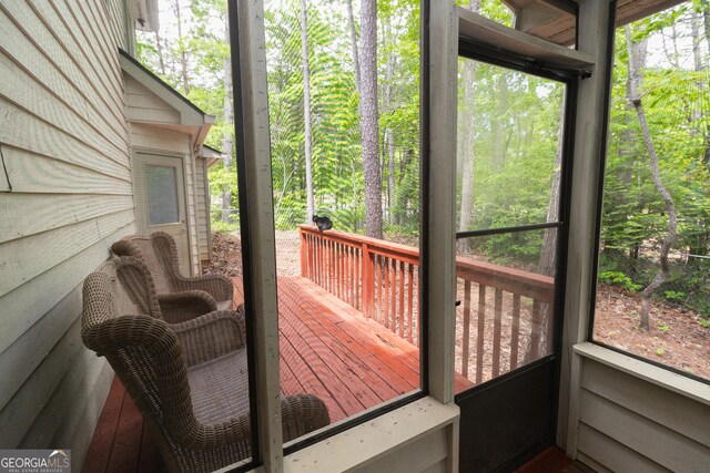 sunroom / solarium featuring plenty of natural light
