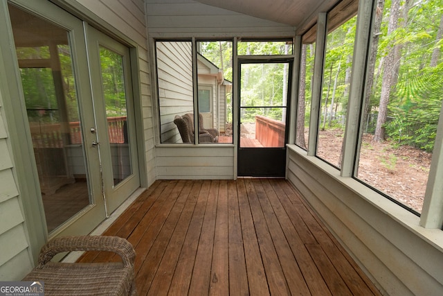 sunroom with lofted ceiling and french doors