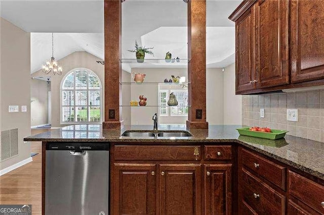 226 Hames Rd Unit 335, Woodstock, GA 30188 - kitchen with stainless steel dishwasher, dark stone counters, tasteful backsplash, light wood-style flooring, and a peninsula