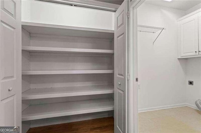 226 Hames Rd Unit 335, Woodstock, GA 30188 - washroom with electric dryer hookup and cabinet space