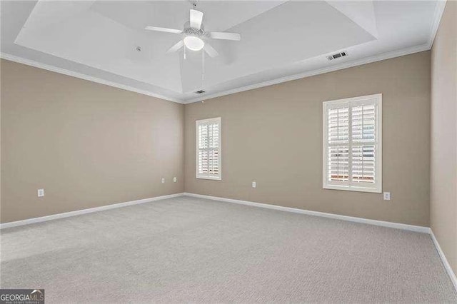 226 Hames Rd Unit 335, Woodstock, GA 30188 - spare room featuring ornamental molding, a tray ceiling, ceiling fan, and carpet flooring