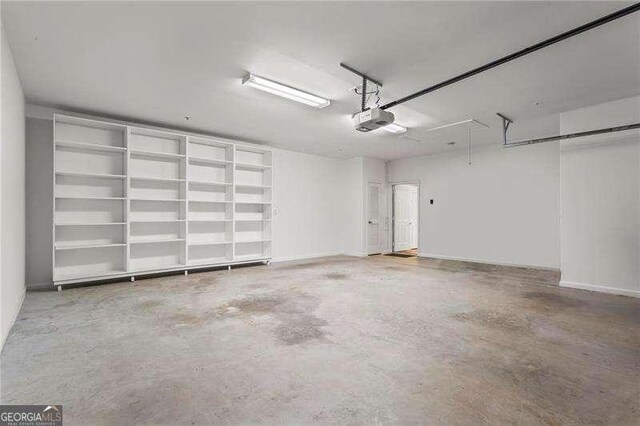 226 Hames Rd Unit 335, Woodstock, GA 30188 - garage with a garage door opener