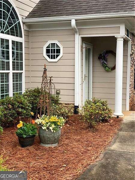 226 Hames Rd Unit 335, Woodstock, GA 30188 - entrance to property with a shingled roof