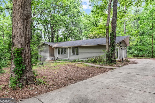 310 Weatherly Woods Dr, Winterville, GA 30683 - view of front of property with entry steps, roof with shingles, and concrete driveway
