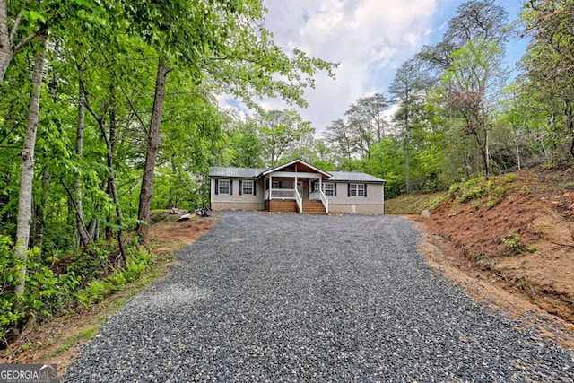 65 Redwood Ln, Tiger, GA 30576 - manufactured / mobile home featuring gravel driveway and covered porch