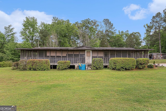 2249 Jackson Lake Rd, Mansfield, GA 30055 - view of front facade with a sunroom and a front yard