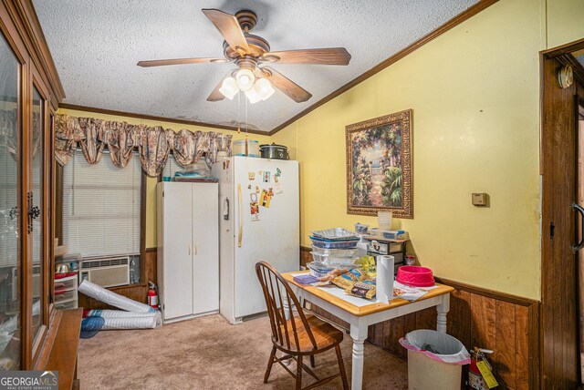 2249 Jackson Lake Rd, Mansfield, GA 30055 - dining space with vaulted ceiling, ornamental molding, a textured ceiling, carpet flooring, and a ceiling fan