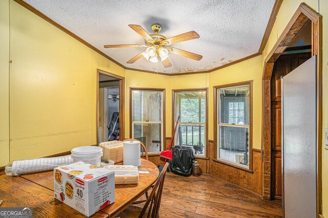 2249 Jackson Lake Rd, Mansfield, GA 30055 - dining area featuring ornamental molding, wood-type flooring, a textured ceiling, ceiling fan, and a wainscoted wall