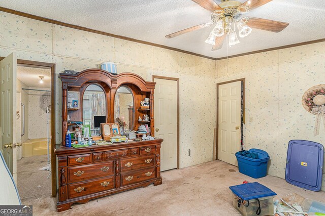 2249 Jackson Lake Rd, Mansfield, GA 30055 - carpeted bedroom featuring crown molding, a textured ceiling, ensuite bath, wallpapered walls, and a ceiling fan