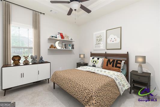 bedroom with carpet floors, a raised ceiling, and a ceiling fan