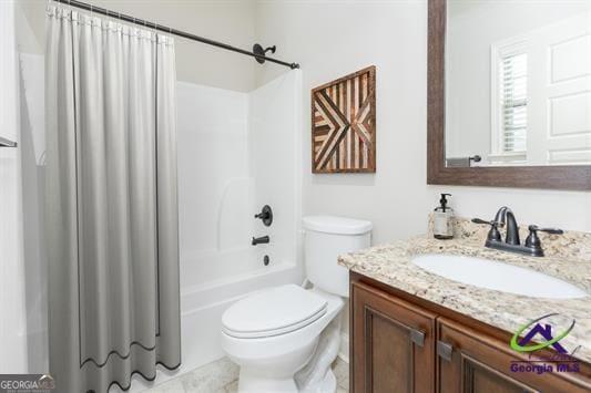 bathroom featuring toilet, vanity, and shower / tub combo