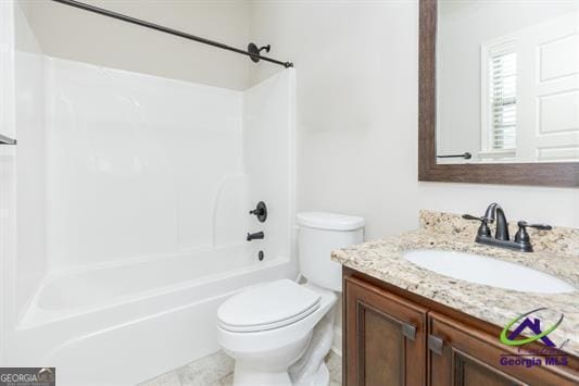 full bath featuring toilet, vanity, and shower / bathtub combination