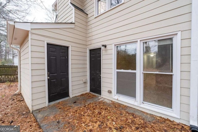property entrance with fence