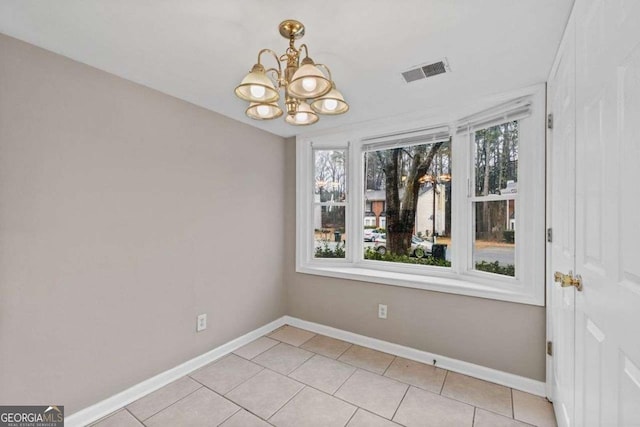 foyer featuring baseboards, stairs, and light tile patterned flooring