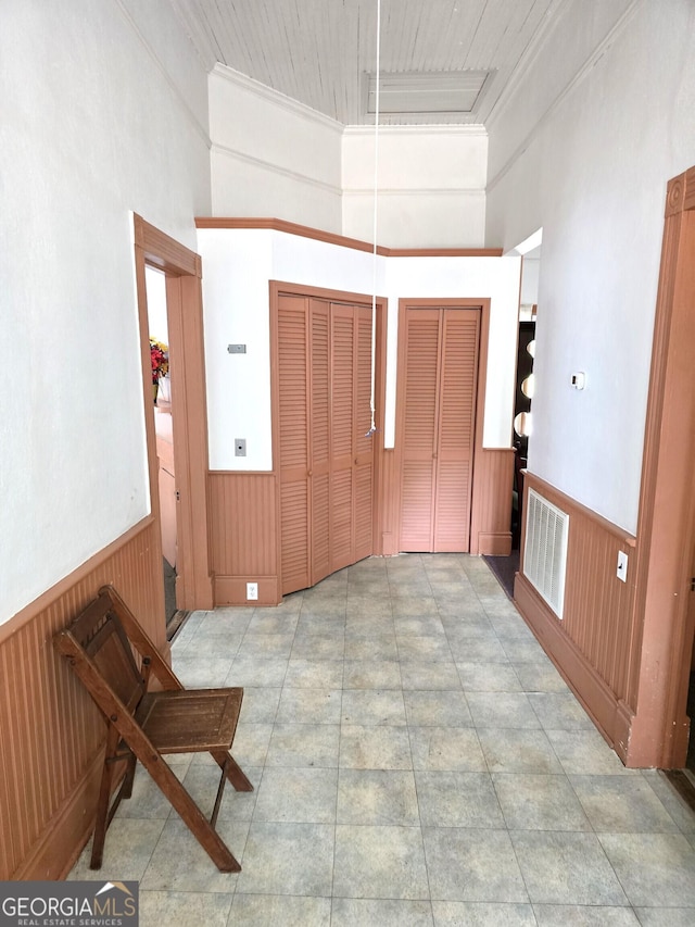 61 Calhoun St, Gibson, GA 30810 - foyer entrance with a wainscoted wall, wooden walls, and a high ceiling