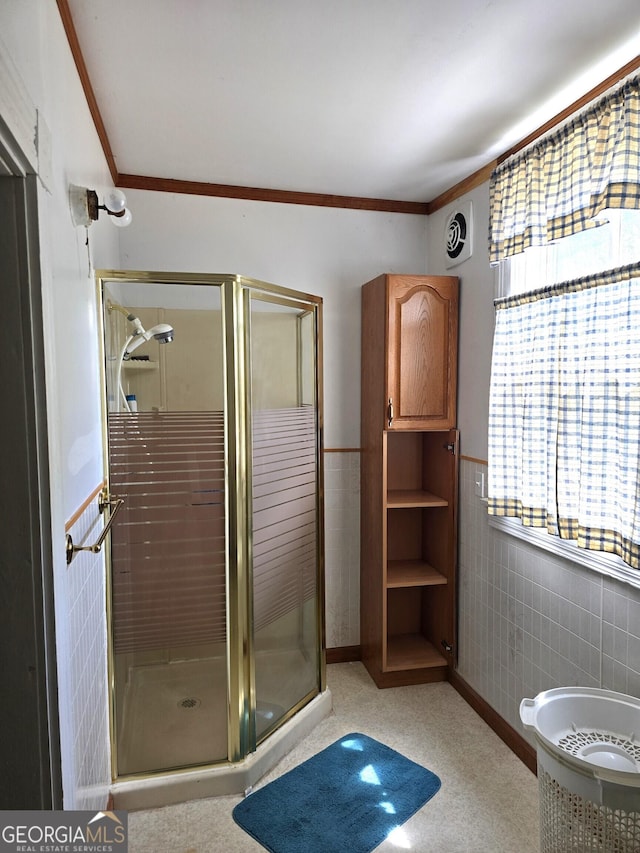 61 Calhoun St, Gibson, GA 30810 - full bath with ornamental molding, tile walls, a shower stall, and wainscoting