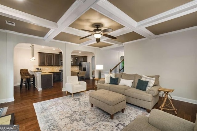 4415 Saint Andrews Crest Dr, Cumming, GA 30040 - living area featuring arched walkways, coffered ceiling, ceiling fan, beam ceiling, and dark wood-style flooring
