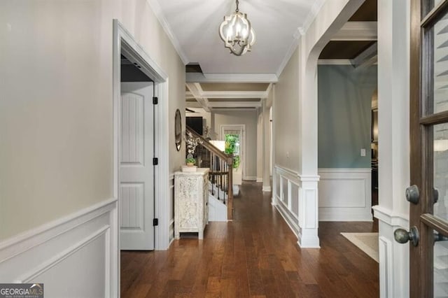 4415 Saint Andrews Crest Dr, Cumming, GA 30040 - foyer entrance featuring arched walkways, a chandelier, crown molding, coffered ceiling, and wood finished floors