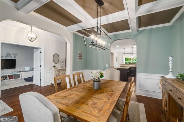 4415 Saint Andrews Crest Dr, Cumming, GA 30040 - dining space featuring arched walkways, a chandelier, wood finished floors, coffered ceiling, and beam ceiling