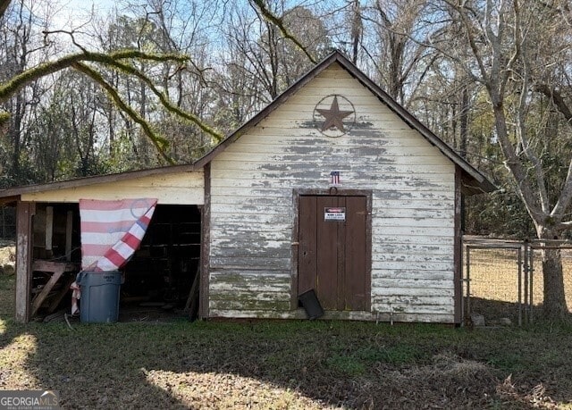 view of outdoor structure with an outdoor structure and fence