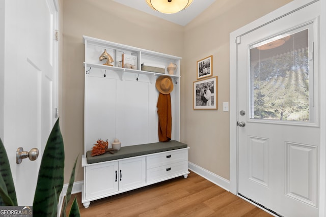 mudroom featuring light wood-style floors and baseboards