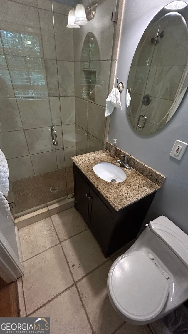 220 N Springs Ct, Sandy Springs, GA 30328 - bathroom featuring vanity, a shower stall, and tile patterned flooring