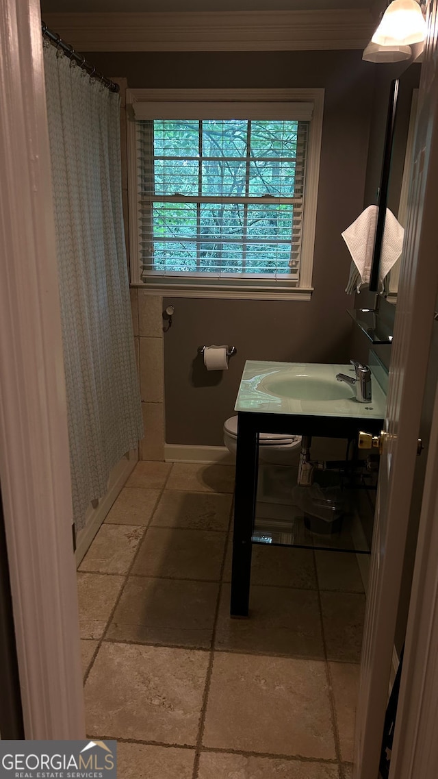 220 N Springs Ct, Sandy Springs, GA 30328 - full bath with vanity, stone tile flooring, and ornamental molding