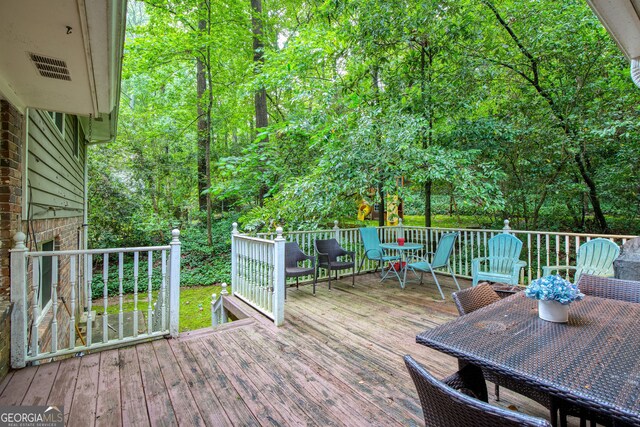 220 N Springs Ct, Sandy Springs, GA 30328 - wooden deck featuring outdoor dining space