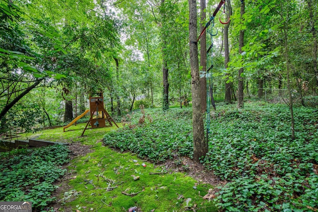220 N Springs Ct, Sandy Springs, GA 30328 - view of yard with a playground and a view of trees