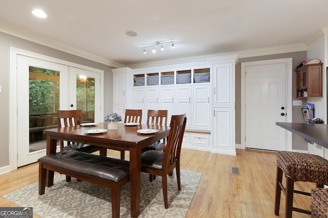 220 N Springs Ct, Sandy Springs, GA 30328 - dining area with french doors, light wood finished floors, and crown molding
