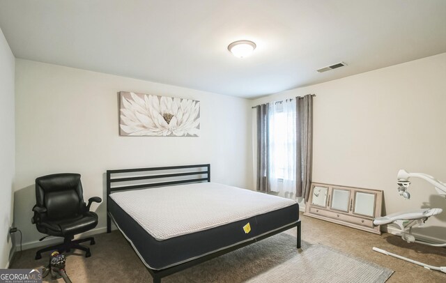2496 Osceola Rd, Lithonia, GA 30058 - carpeted bedroom with baseboards