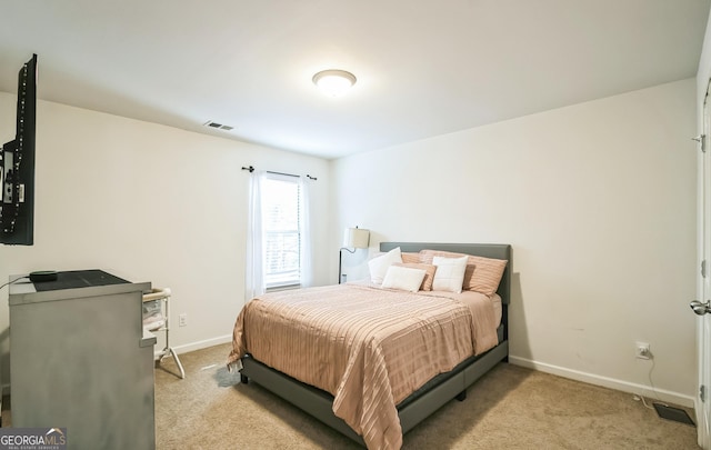 2496 Osceola Rd, Lithonia, GA 30058 - bedroom with light carpet and baseboards