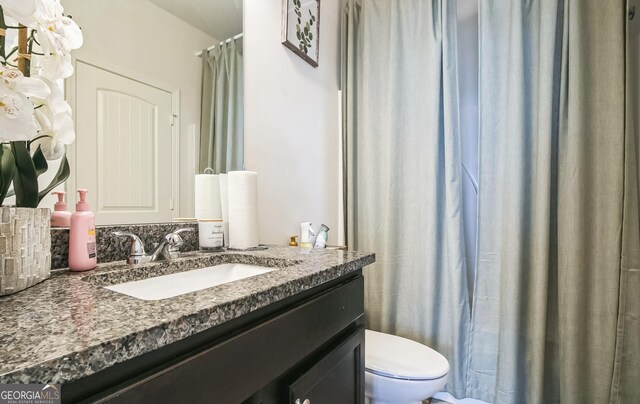 2496 Osceola Rd, Lithonia, GA 30058 - bathroom with toilet and vanity