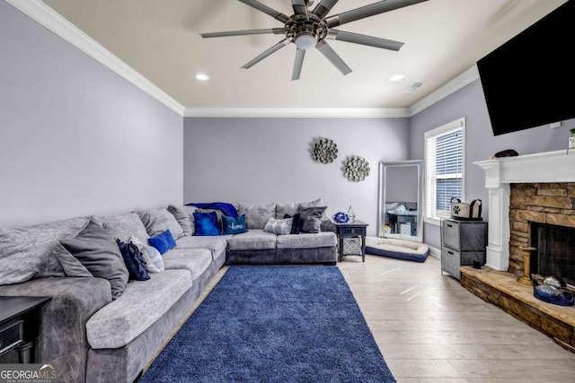 2102 Braswell Ln, Loganville, GA 30052 - living area with ceiling fan, ornamental molding, light wood-style flooring, recessed lighting, and a fireplace