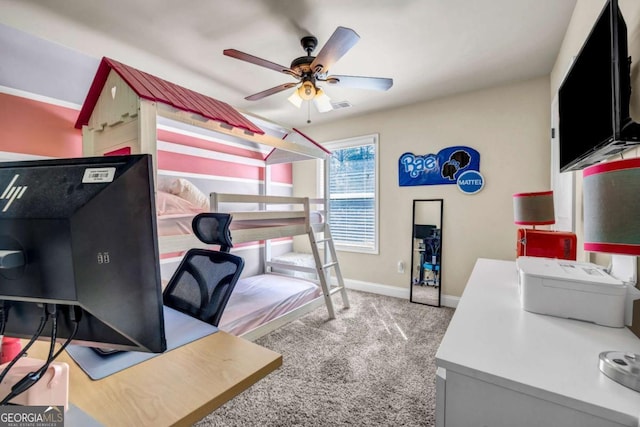 2102 Braswell Ln, Loganville, GA 30052 - bedroom with baseboards, carpet flooring, a desk, and a ceiling fan