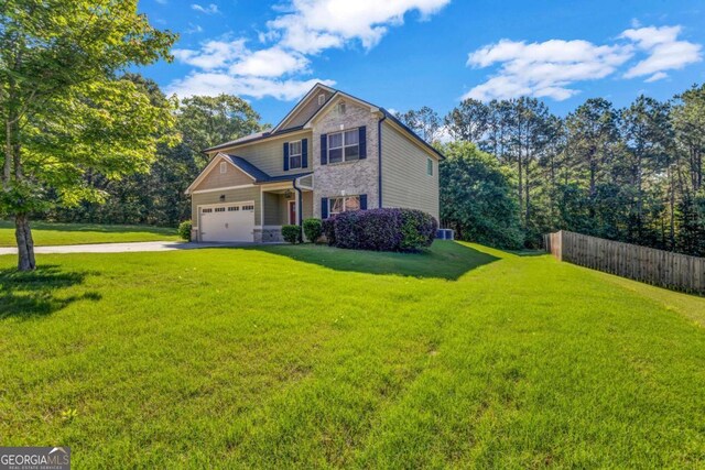 2102 Braswell Ln, Loganville, GA 30052 - craftsman house featuring driveway and an attached garage
