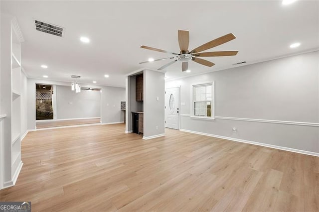 2828 Cloverhurst, Atlanta, GA 30344 - unfurnished living room with recessed lighting, a ceiling fan, light wood finished floors, baseboards, and crown molding