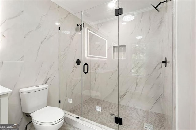 2828 Cloverhurst, Atlanta, GA 30344 - bathroom featuring toilet, a marble finish shower, vanity, tile walls, and ornamental molding